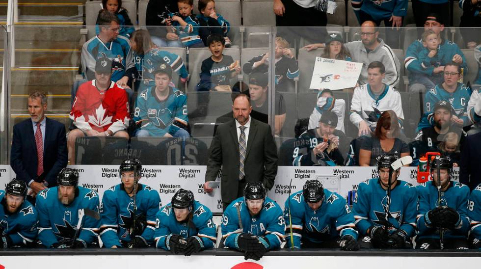 San Jose Sharks head coach Peter DeBoer watches the game from the bench against the Calgary Fla ...