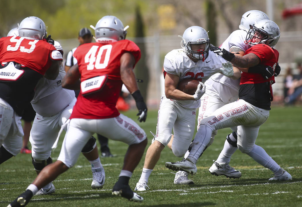 UNLV Rebels running back Chad Magyar (36) runs the ball during the spring football game at Pete ...