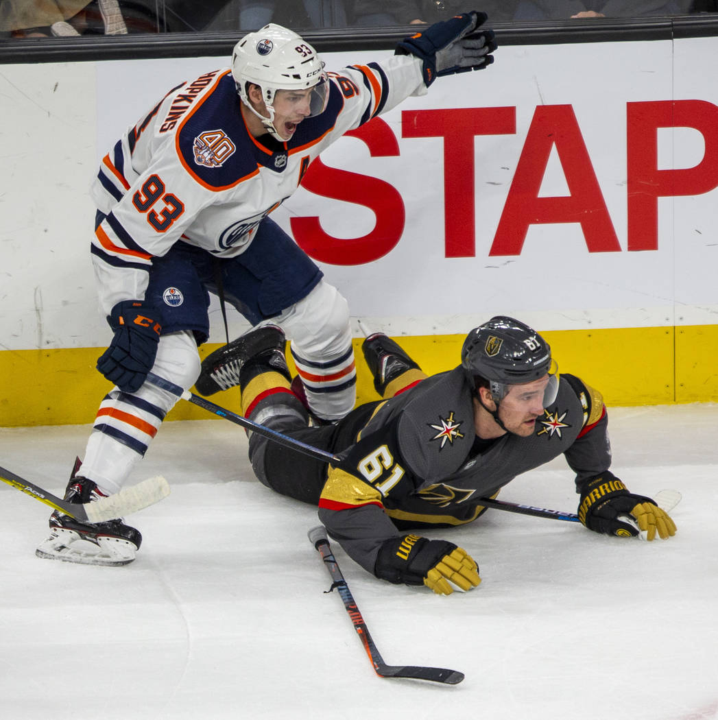 Vegas Golden Knights right wing Mark Stone (61) looks to the puck from the ice with Edmonton Oi ...