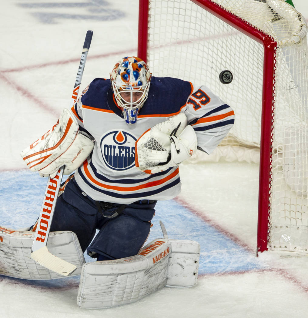 Edmonton Oilers goaltender Mikko Koskinen (19) deflects a shot on goal from the Vegas Golden Kn ...