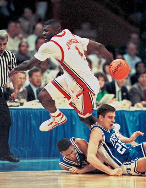 UNLV Rebels forward Larry Johnson (4) performs a behind the back pass during the NCAA Men's bas ...