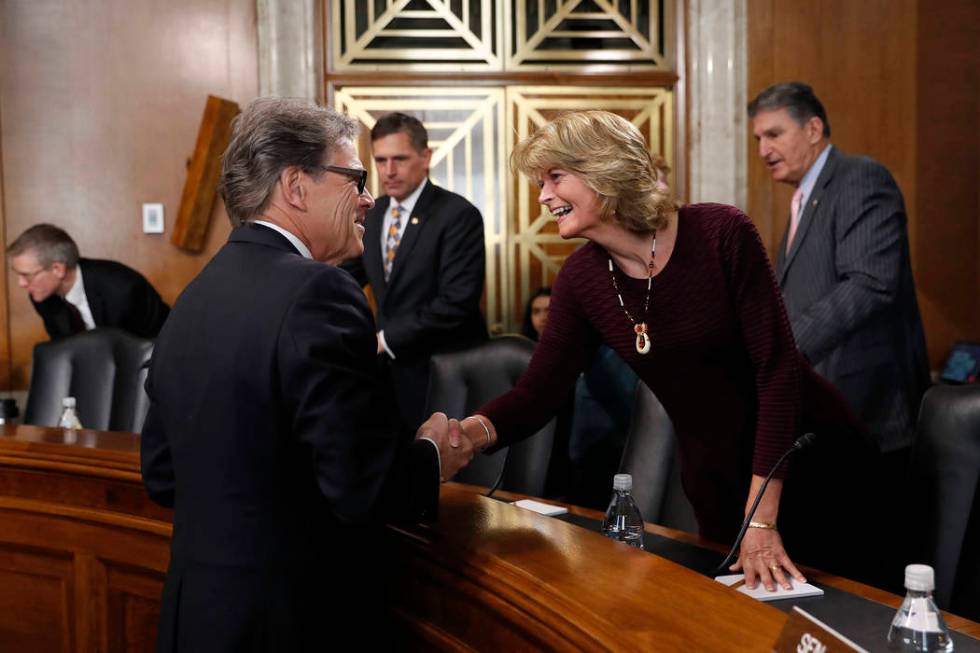 Energy Secretary Rick Perry, left, speaks with Sen. Lisa Murkowski, R-Alaska, chairwoman of the ...