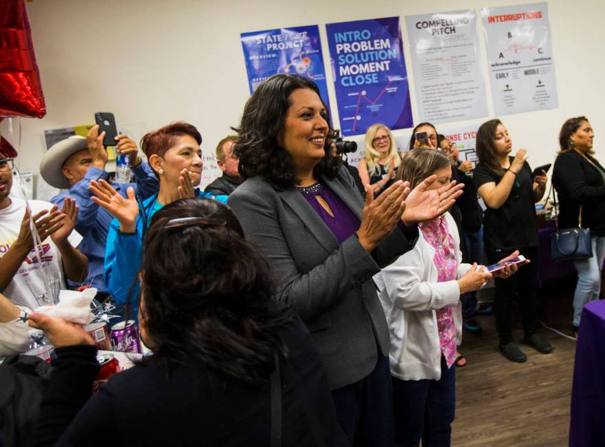 Former assemblywoman Olivia Diaz, a Las Vegas City Council candidate for Ward 3, center, claps ...