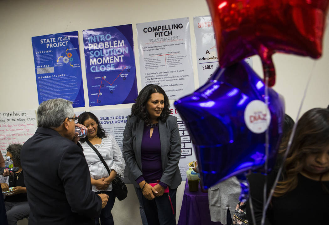 Former assemblywoman Olivia Diaz, a Las Vegas City Council candidate for Ward 3, center, talks ...