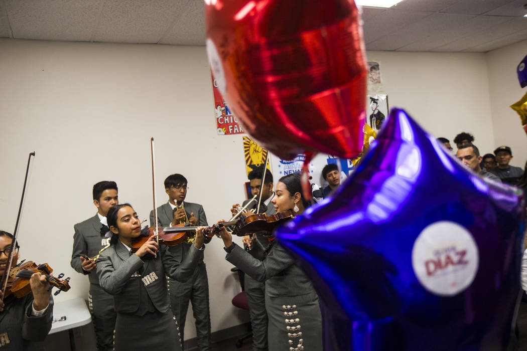 Members of Mariachi Alma del Canon, out of Canyon Springs High School, perform during an electi ...