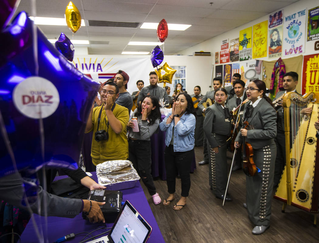 Supporters of former assemblywoman Olivia Diaz, a Las Vegas City Council candidate, reacts as r ...