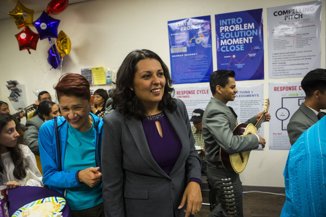 Former assemblywoman Olivia Diaz, a Las Vegas City Council candidate for Ward 3, center, visits ...