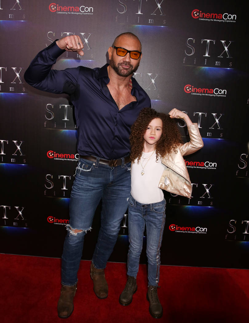 Actors Dave Bautista, left, and Chloe Coleman from MySpy arrive at CinemaCon red carpet at The ...
