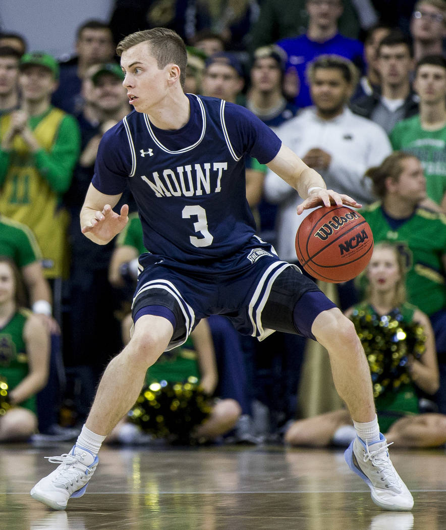 Mount St. Mary's Jonah Antonio (3) moves the ball around the perimeter during the first half of ...