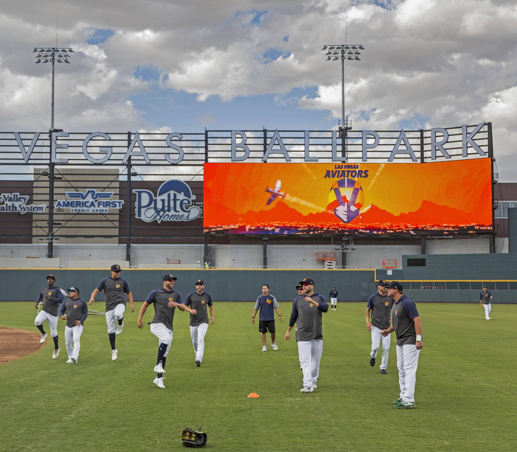 Aviators players warm up before the start of practice during media day at Las Vegas Ballpark on ...