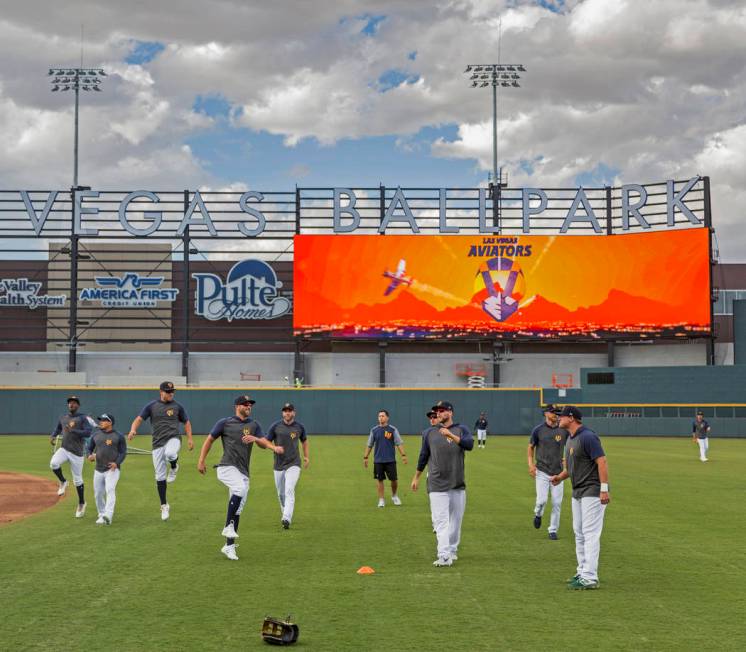 Aviators players warm up before the start of practice during media day at Las Vegas Ballpark on ...