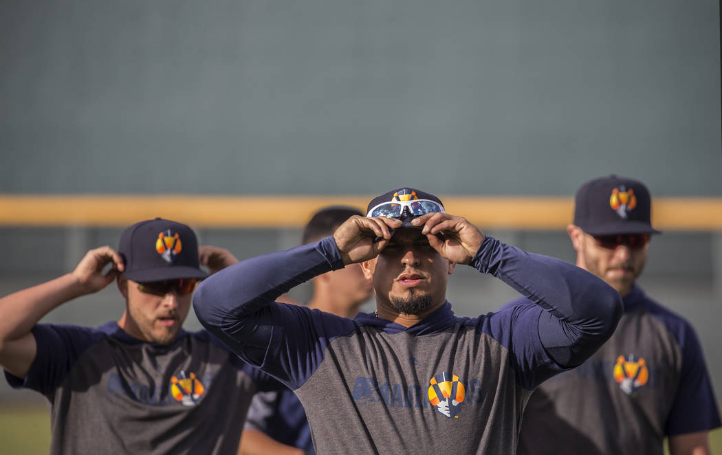 Aviators players warm up before the start of practice during media day at Las Vegas Ballpark on ...