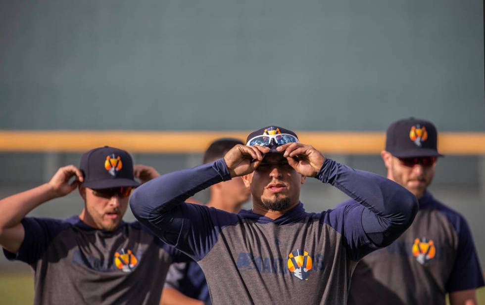 Aviators players warm up before the start of practice during media day at Las Vegas Ballpark on ...