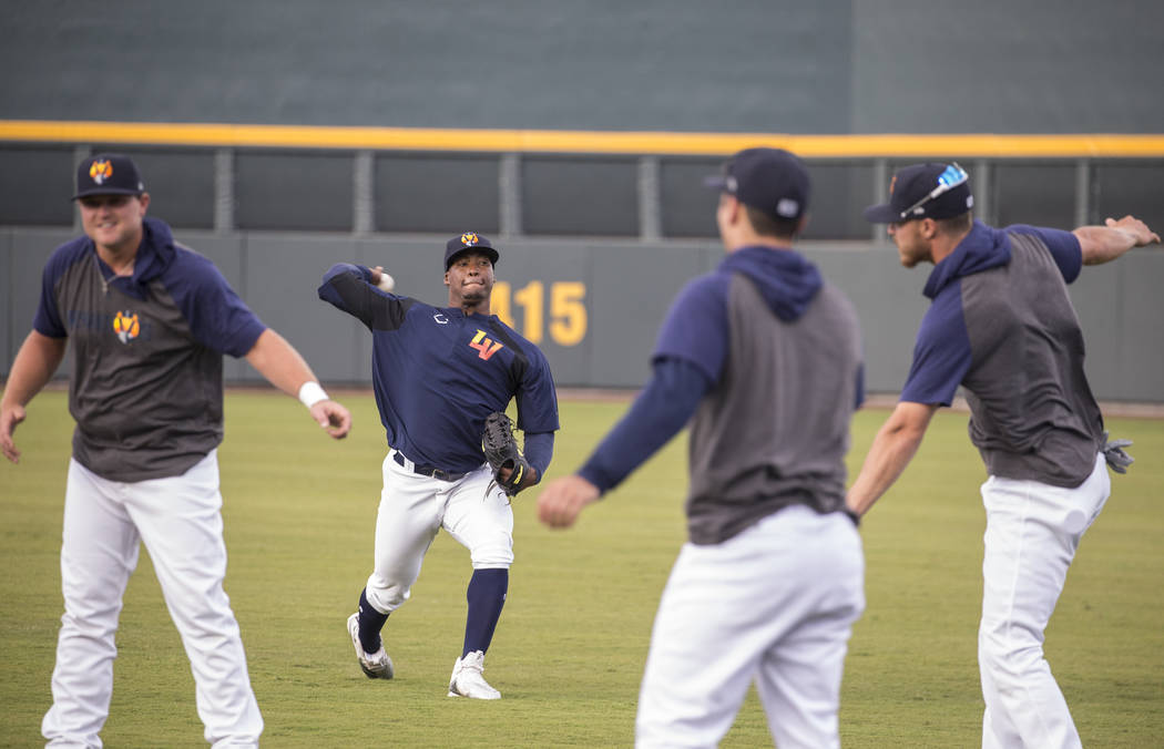 Aviators players warm up before the start of practice during media day at Las Vegas Ballpark on ...