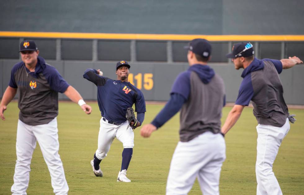 Aviators players warm up before the start of practice during media day at Las Vegas Ballpark on ...