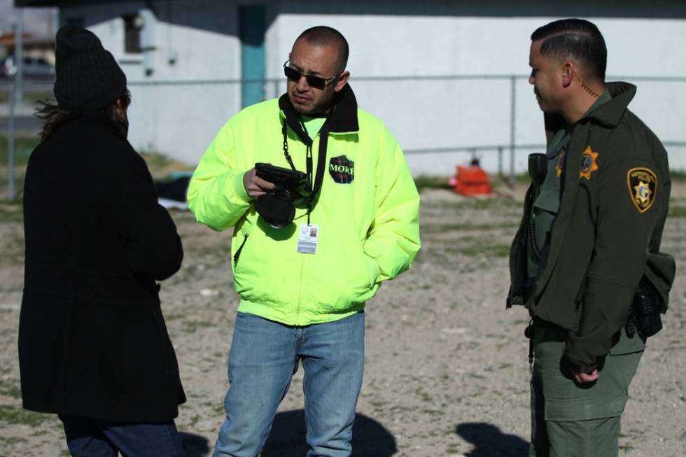 Homeless man Charles Whritenour, from left, talks to Rafael Rodriguez-Aguayo, outreach case wor ...