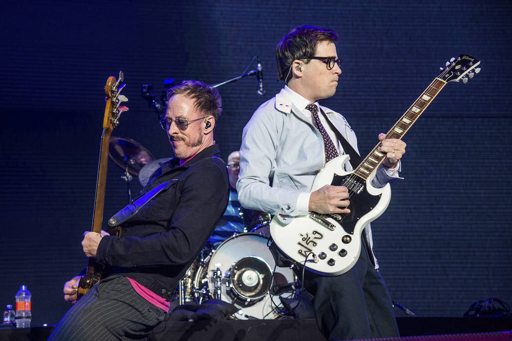 Scott Shriner, left, and Rivers Cuomo of Weezer perform at the 2017 KROQ Almost Acoustic Christ ...
