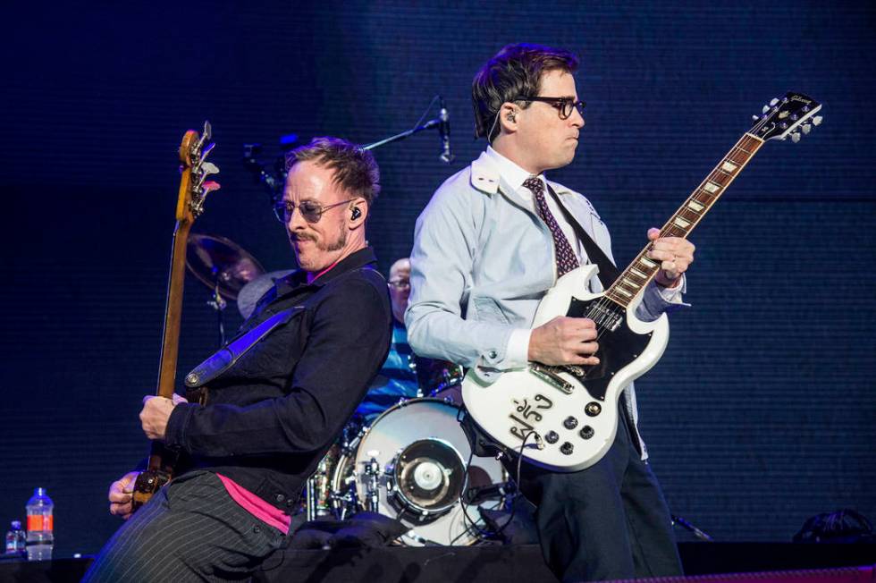 Scott Shriner, left, and Rivers Cuomo of Weezer perform at the 2017 KROQ Almost Acoustic Christ ...