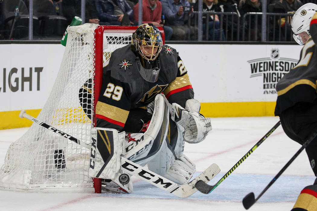 Vegas Golden Knights goaltender Marc-Andre Fleury (29) blocks a shot from the Boston Bruins dur ...