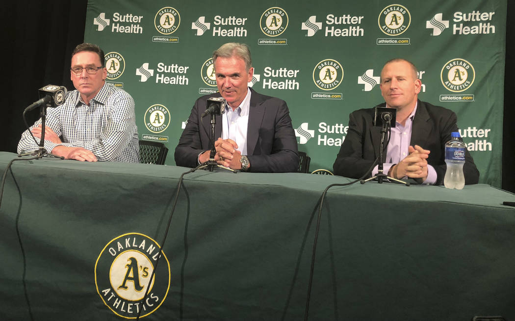 From left, Oakland Athletics manager Bob Melvin, executive vice president of baseball operation ...