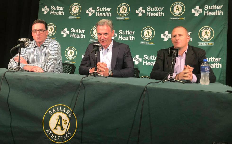 From left, Oakland Athletics manager Bob Melvin, executive vice president of baseball operation ...