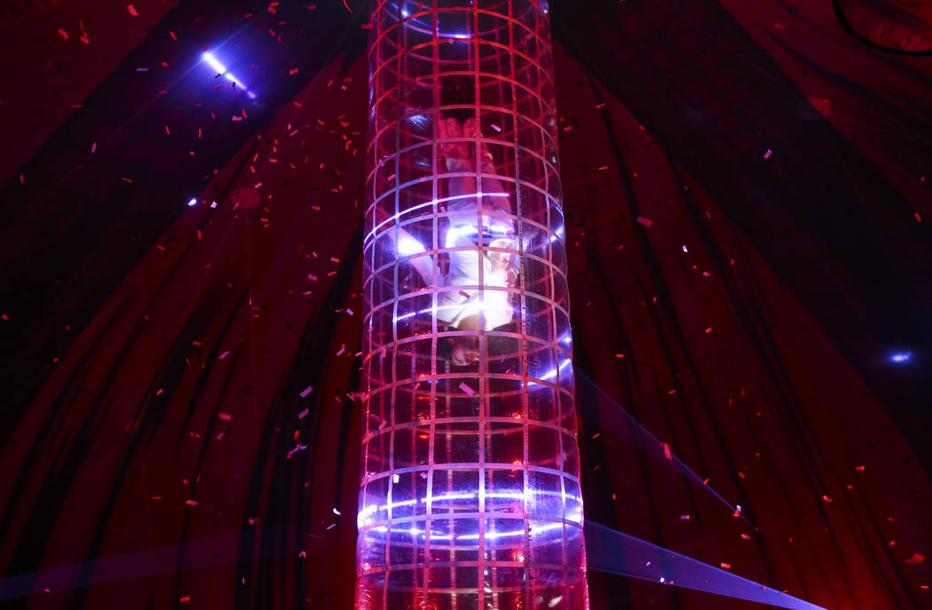 Cast members in "Fuerza Bruta" perform as part of a media preview at the show's tent ...