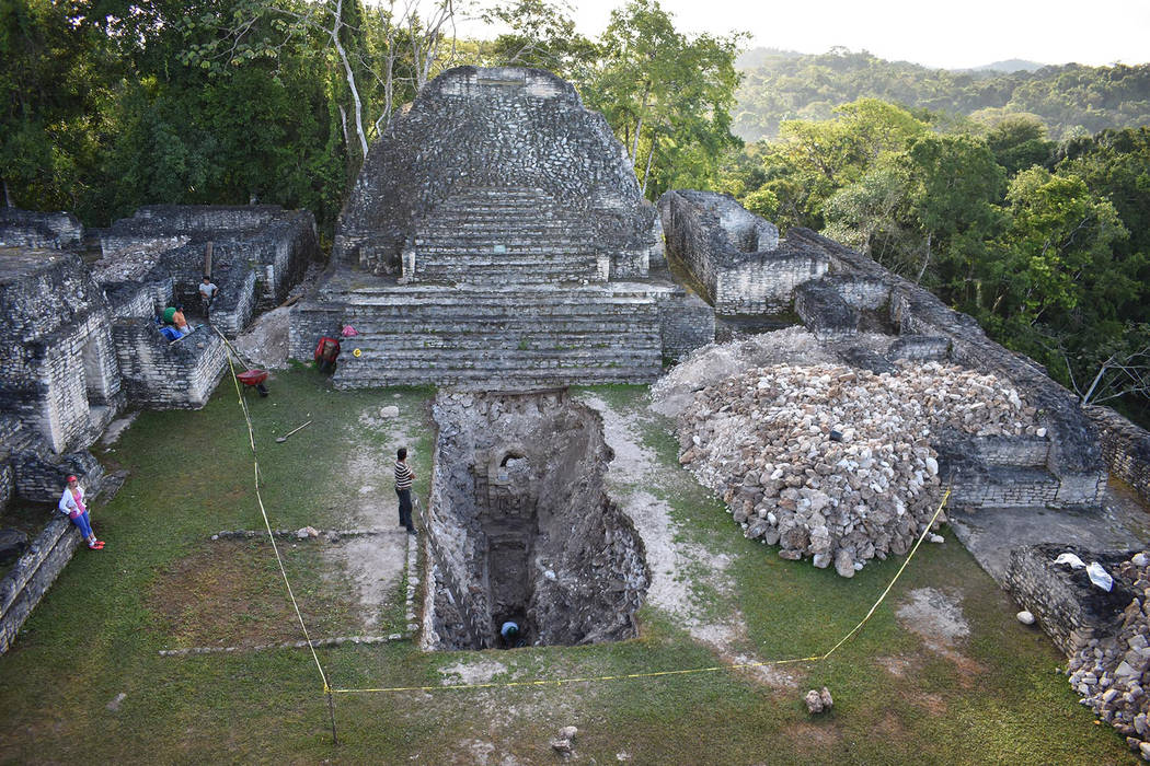 Researchers work at the Maya ruin site of Caracol in Belize in 2017. (Arlen and Diane Chase)