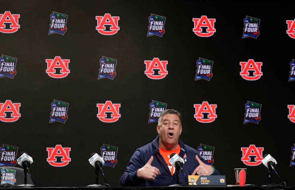 Auburn head coach Bruce Pearl answers questions after a practice session for the semifinals of ...