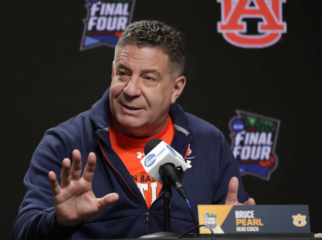 Auburn head coach Bruce Pearl answers questions after a practice session for the semifinals of ...