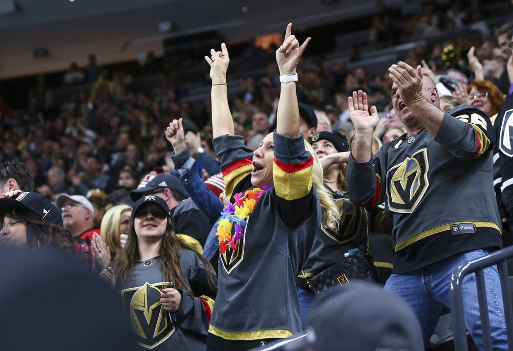 Golden Knights fans celebrate a goal by Golden Knights right wing Mark Stone, not pictured, dur ...