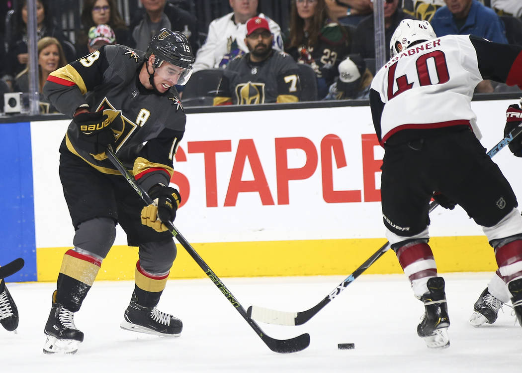 Golden Knights right wing Reilly Smith (19) moves the piuck around Arizona Coyotes right wing M ...
