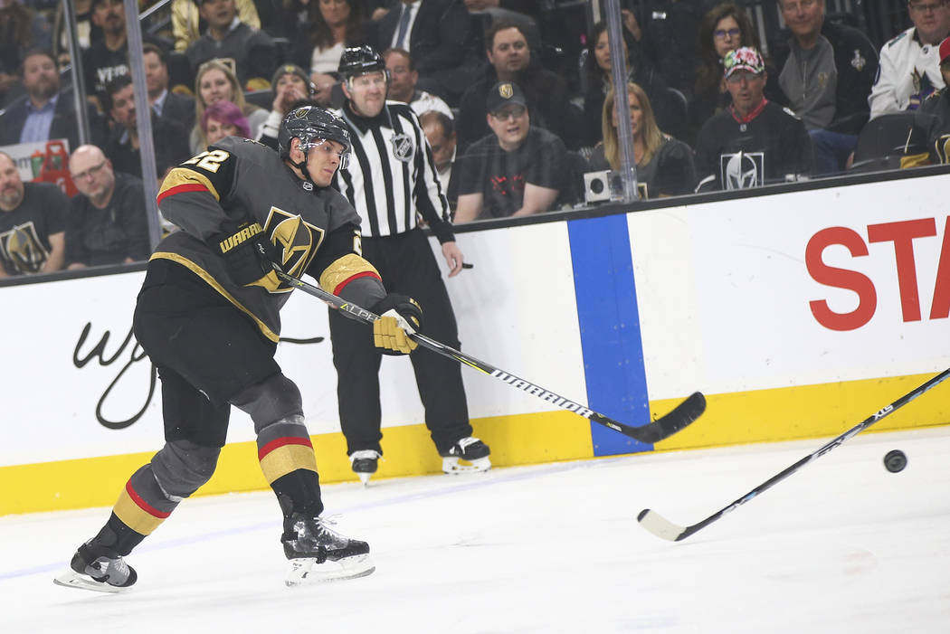 Golden Knights defenseman Nick Holden (22) shoots against the Arizona Coyotes during the first ...