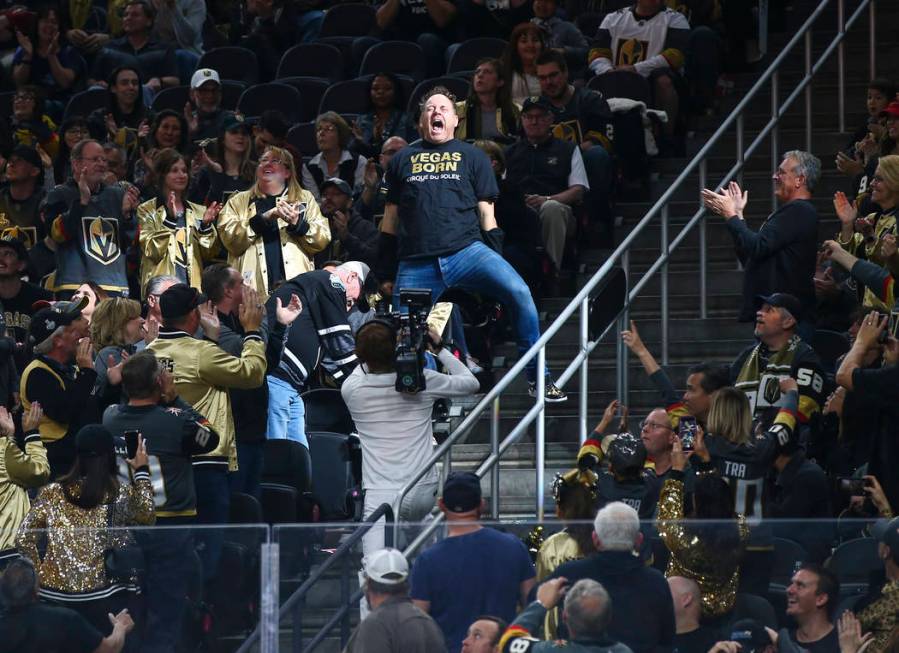 Crowd igniter Cameron Hughes entertains the crowd during the first period of an NHL hockey game ...