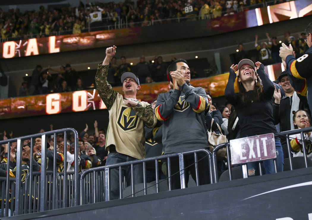 Golden Knights fans celebrate a goal by Golden Knights right wing Mark Stone, not pictured, dur ...