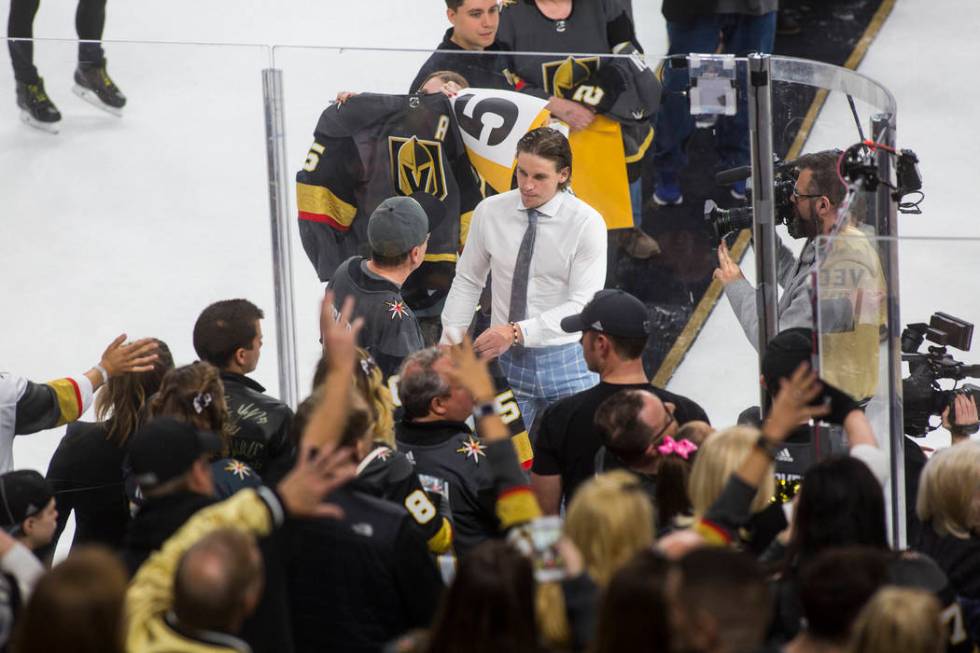 Golden Knights center Erik Haula joins other players in signing and giving away jerseys to luck ...