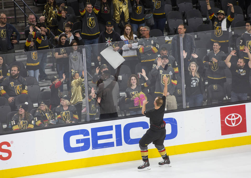 Golden Knights defenseman Nate Schmidt throws a T-shirt into the crowd during the postgame "Jer ...