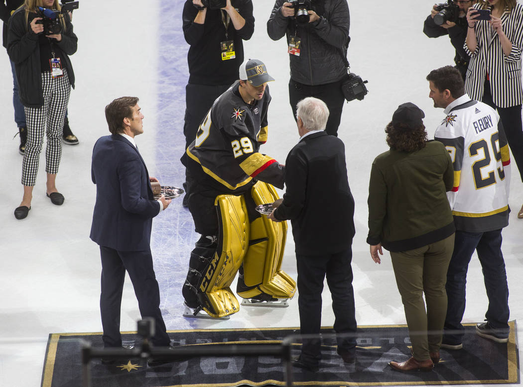 Golden Knights goaltender Marc-Andre Fleury (29) shakes hands with team owner Bill Foley after ...