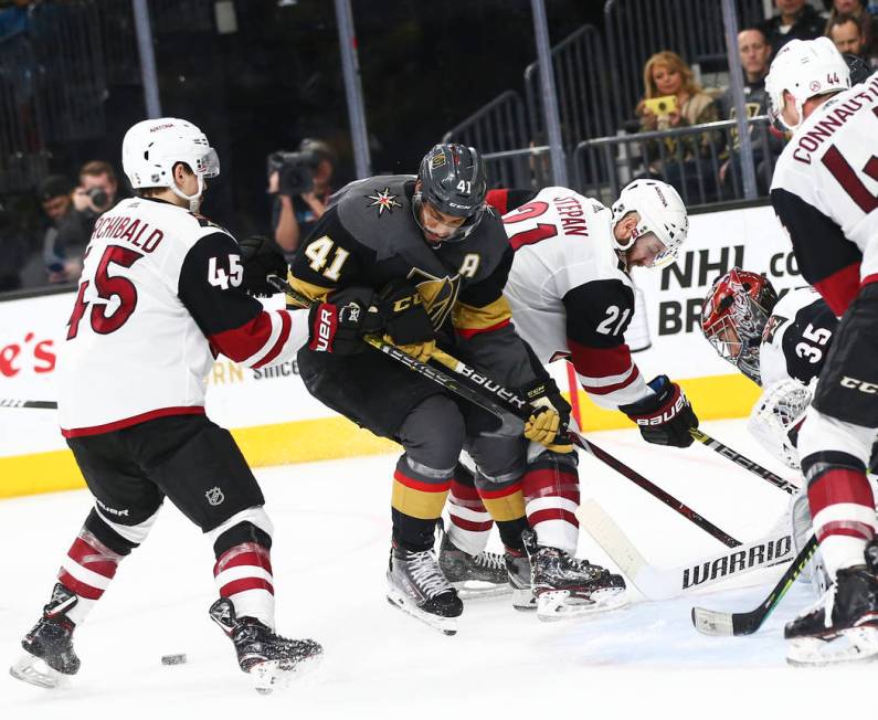 Golden Knights center Pierre-Edouard Bellemare (41) and Arizona Coyotes right wing Josh Archiba ...