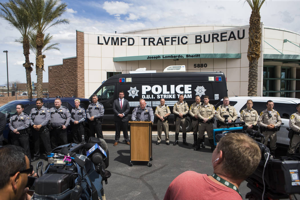 Nevada Highway Patrol Capt. Charles Haycox, center, speaks during an event marking 500 arrests ...