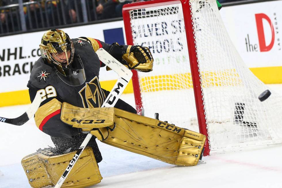 Golden Knights goaltender Marc-Andre Fleury (29) blocks a shot from the Arizona Coyotes during ...