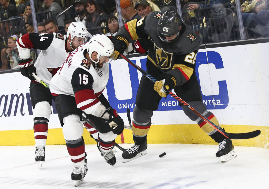 Arizona Coyotes center Brad Richardson (15) and Golden Knights center Paul Stastny (26) battle ...