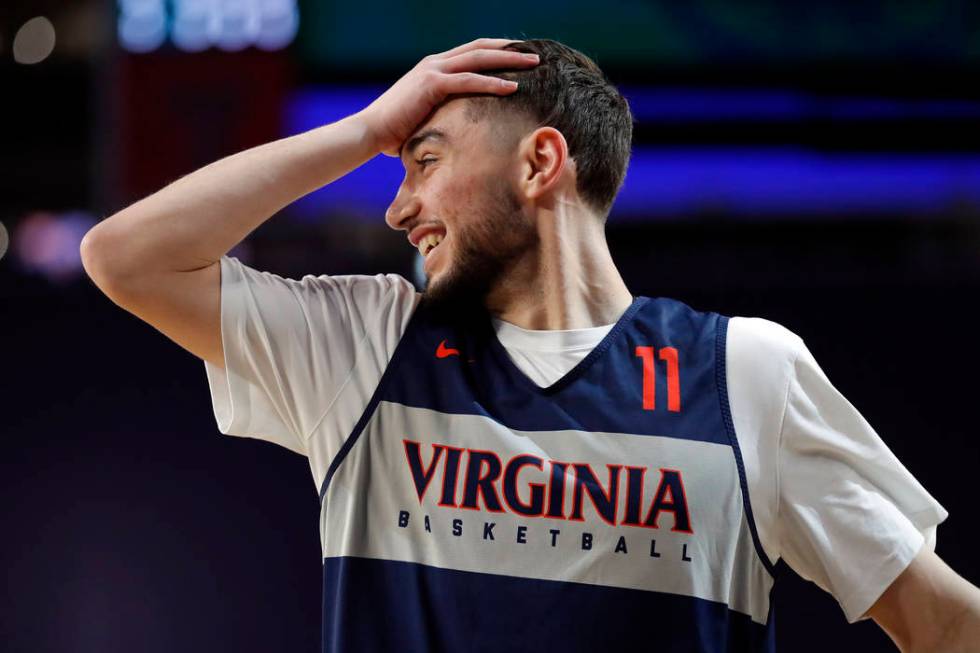 Virginia's Ty Jerome (11) reacts during a practice session for the semifinals of the Final Four ...