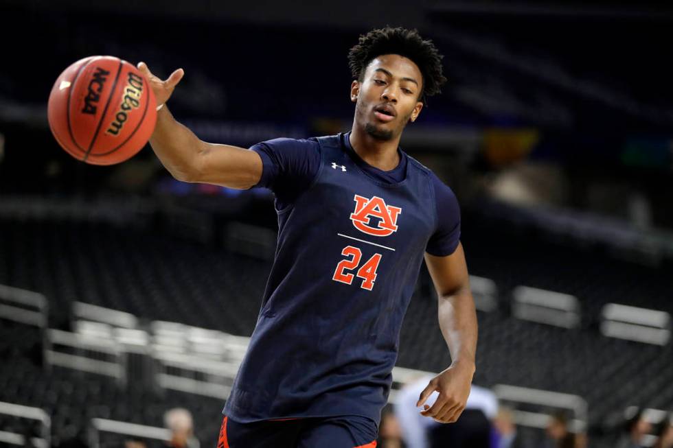 Auburn's Anfernee McLemore (24) warms up during a practice session for the semifinals of the Fi ...