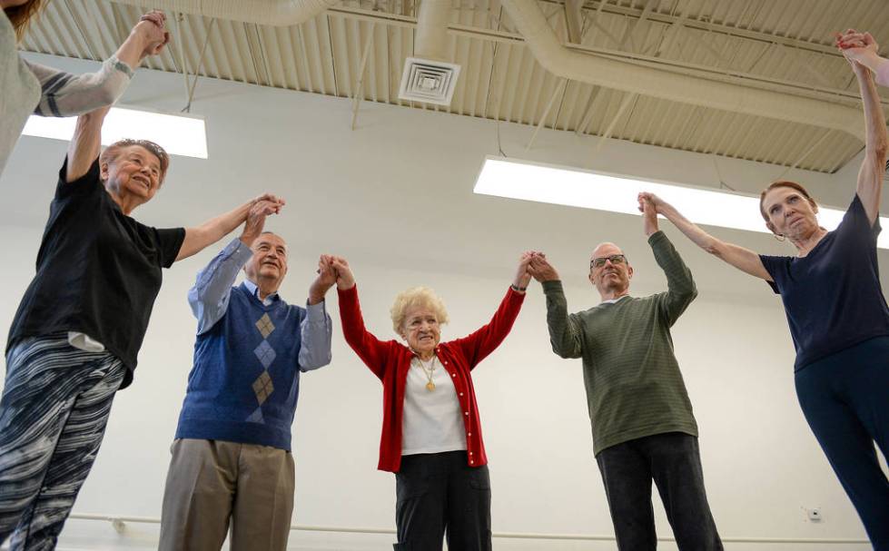 People participate in a ballet class for individuals with Parkinson's disease lead by Pamela La ...