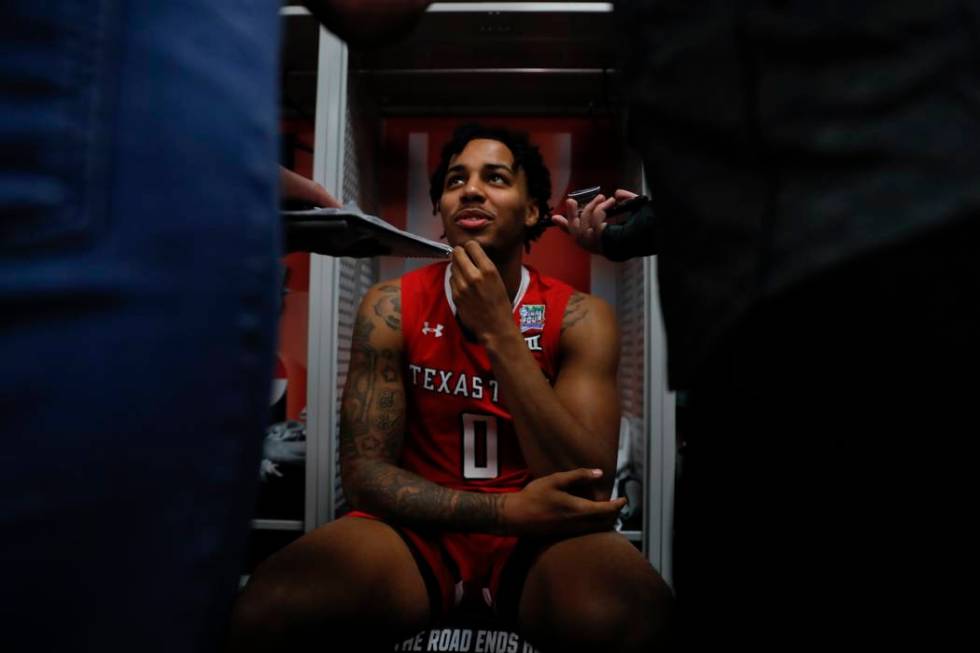 Texas Tech's Kyler Edwards answers questions after a practice session for the semifinals of the ...