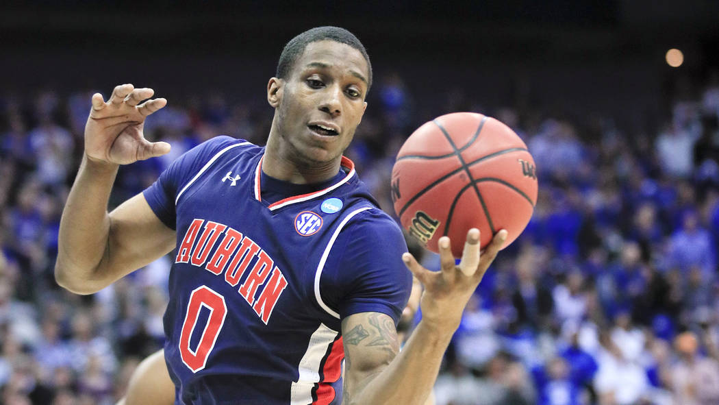 Auburn forward Horace Spencer plays against Kentucky during the first half of the Midwest Regio ...