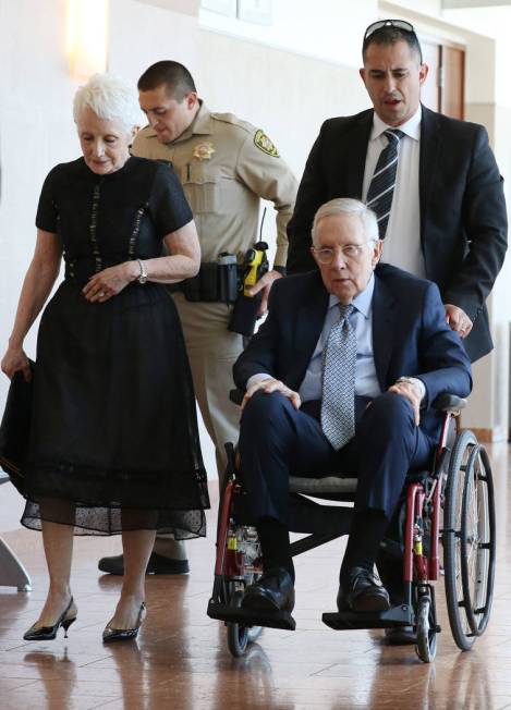 Former U.S. Sen. Harry Reid and his wife, Landra Gould, leave a courtroom at the Regional Justi ...