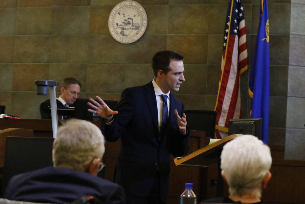 Former U.S. Sen. Harry Reid, left, and his wife, Landra Gould, watch as their attorney Colin Es ...