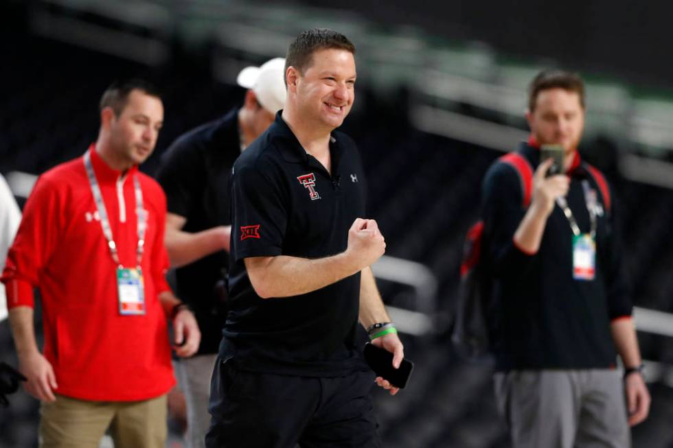 Texas Tech head coach Chris Beard pumps his fist during a practice session for the semifinals o ...