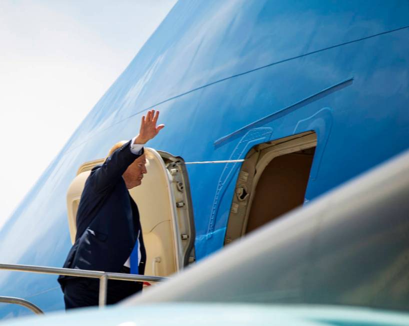 President Donald J. Trump waves as he readies to depart from McCarran International Airport on ...